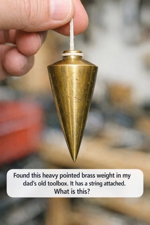 I found this heavy, pointed brass weight in my dad’s old toolbox. It has a string attached—what is it used for?